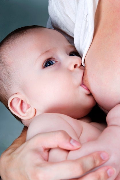 Mother is breast-feeding her baby