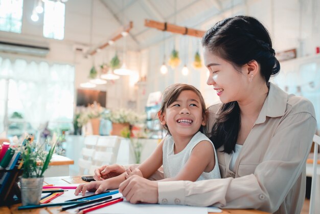 Mother is going to teach children to write books and study online at home