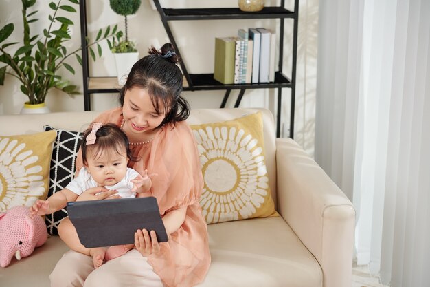 Mother and kid watching cartoon