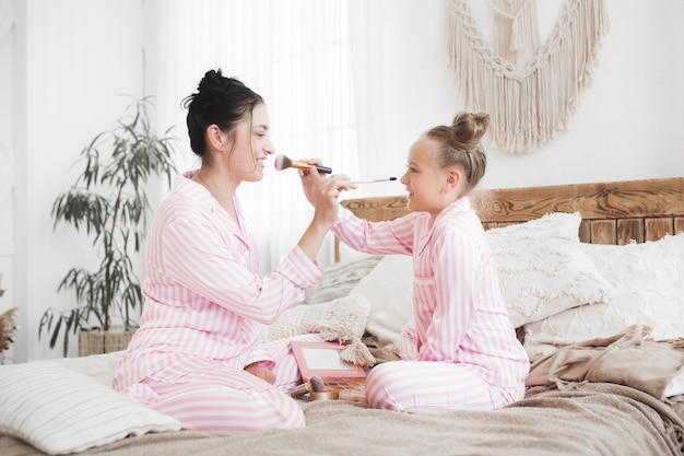 Mother and little daughter having fun together