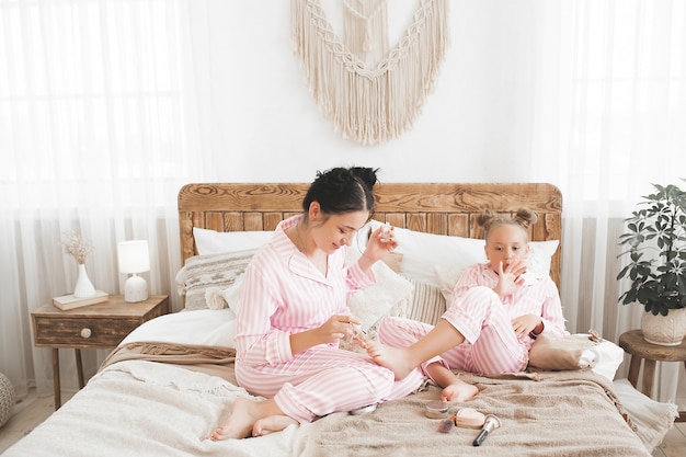 Mother and little daughter having fun together