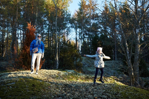 Mother and little daughter travel in mountains