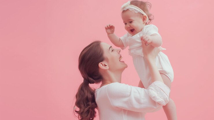 Mother little kid daughter isolated on pastel pink wall background studio portrait