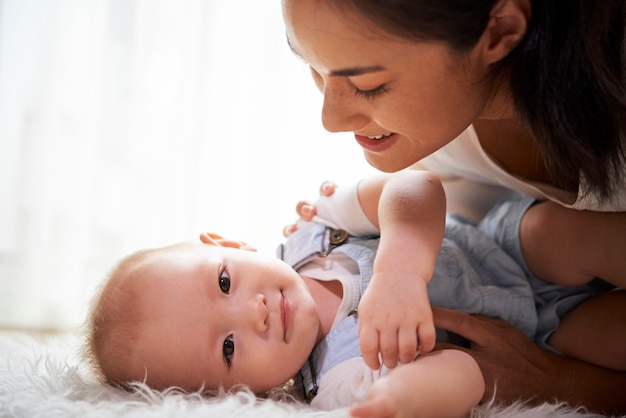 Mother looking at adorable baby