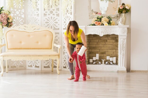 Mother And Mixed Race Baby Playing At Home.