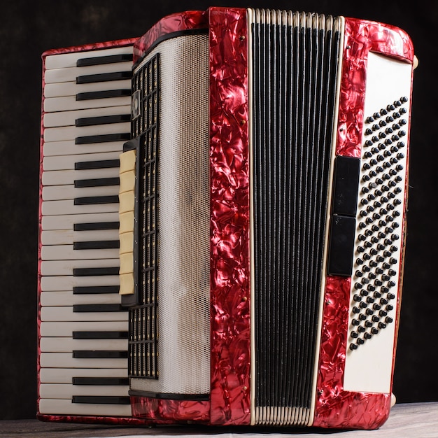 Mother of pearl accordion on a black background.