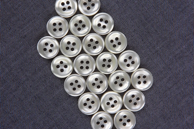 Photo mother of pearl buttons in blue denim