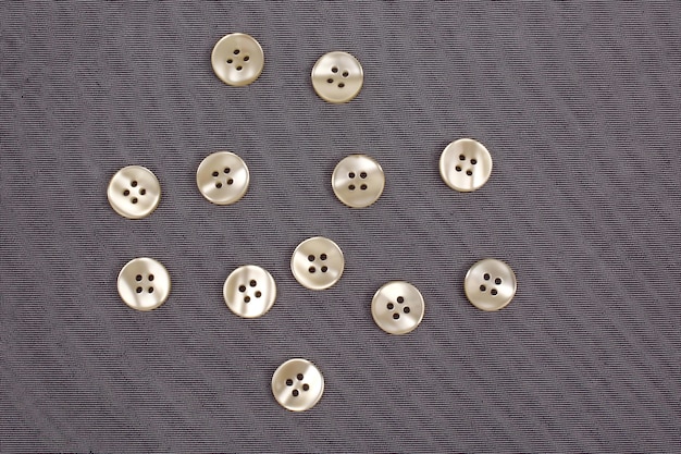 Mother of pearl buttons in grey denim