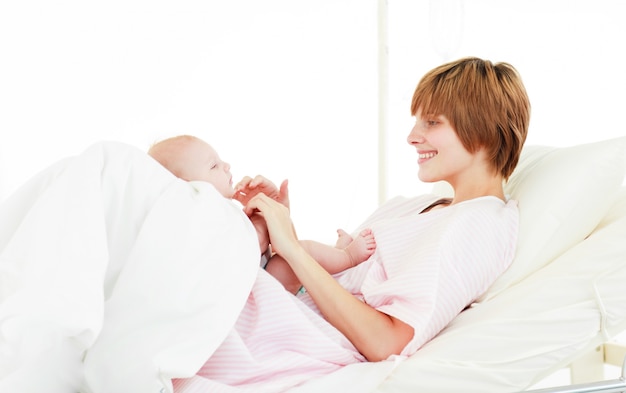 Mother playing with her baby son 