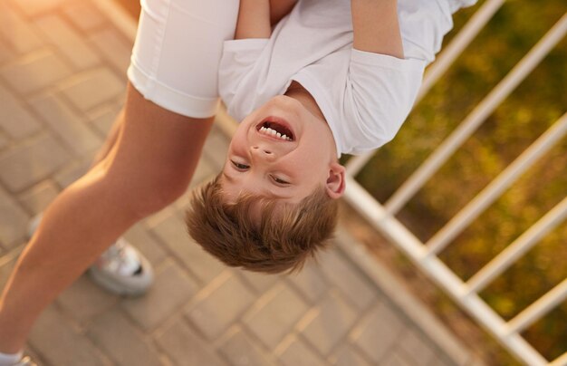 Mother playing with son in park