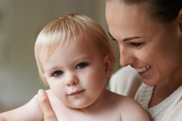 Mother portrait and baby in house nursery and family home with happiness in trust love and support Toddler motherhood and infant with face boy and bonding together for kids childhood memories