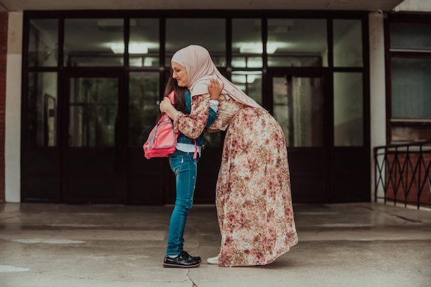 The mother prepares the girl for school Back to school at the time of the coronavirus pandemicNew normal Education during the Covid19 pandemic Selective focusHigh quality photo High quality photo