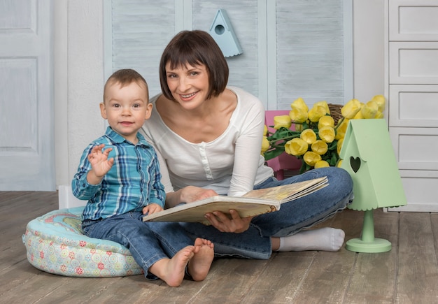 Mother reading book to her baby