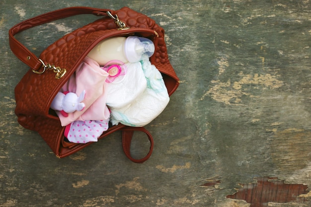 Mother's handbag with items to care for child.