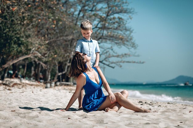 Mother and son on the beach. Thailand. Beautiful sea