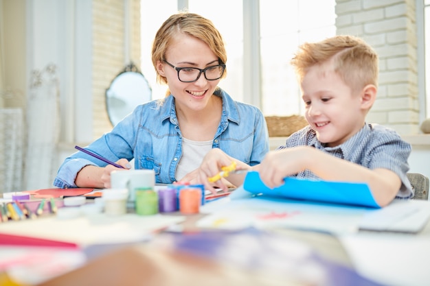 Mother and Son Crafting Together at Home