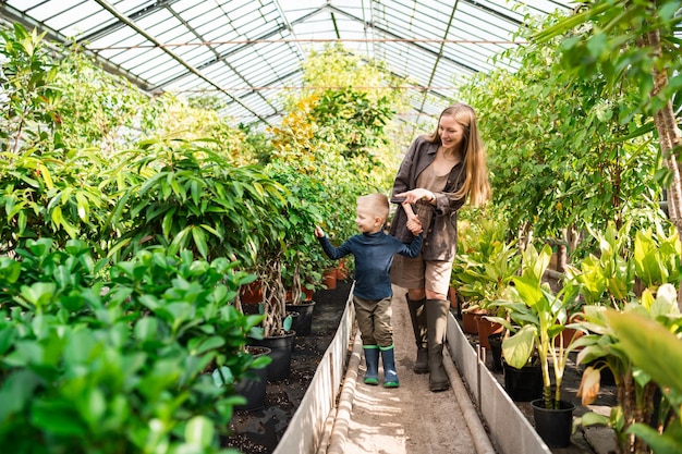 Mother and son on excursion in the greenhouse