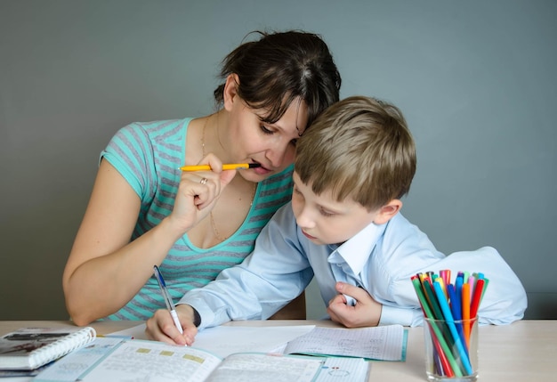 Mother and son do homework together