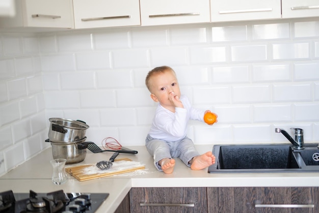 Mother and son making cookies and enjoying in kitchen togetherFamilylove and lifestyle concept