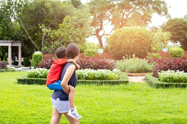 Mother and Son piggyback in the 