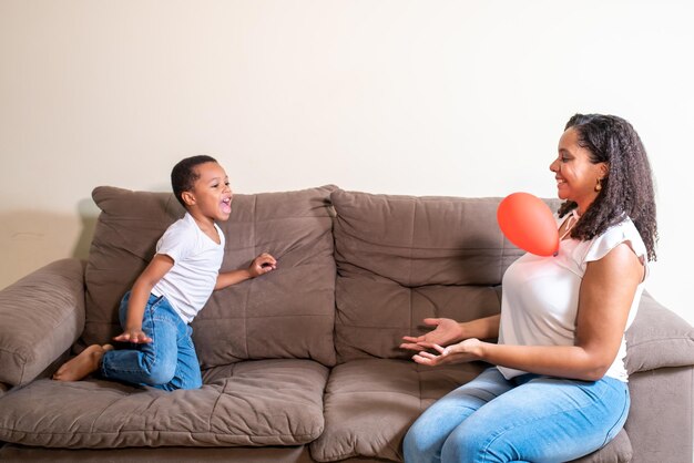 Mother and son playing balloon on mother's day