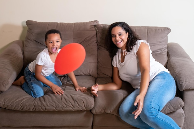 Mother and son playing balloon on mother's day