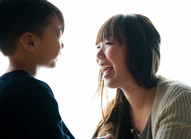 Mother and son playing together with happiness