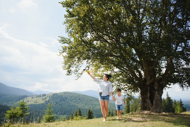 Mother and son playing with a toy airplane