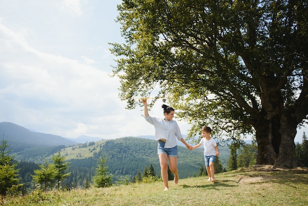 Mother and son playing with a toy airplane