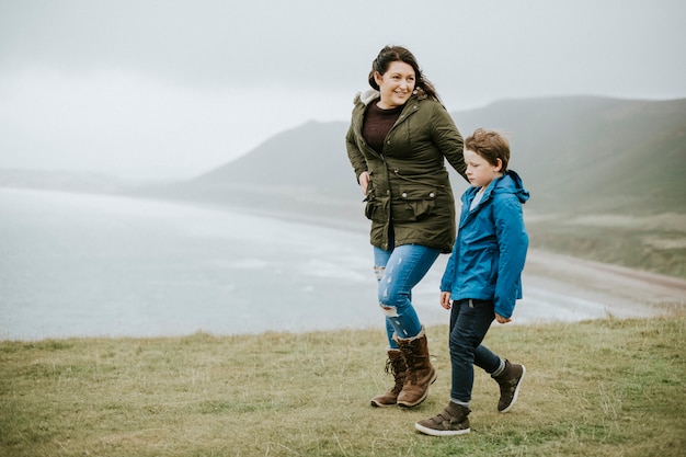 Mother and son strolling together