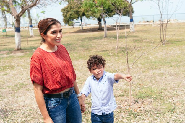 Mother And Son In The Sunny Park Outdoor