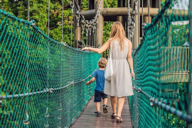 Mother and son at the Suspension bridge in Kuala Lumpur, Malaysia