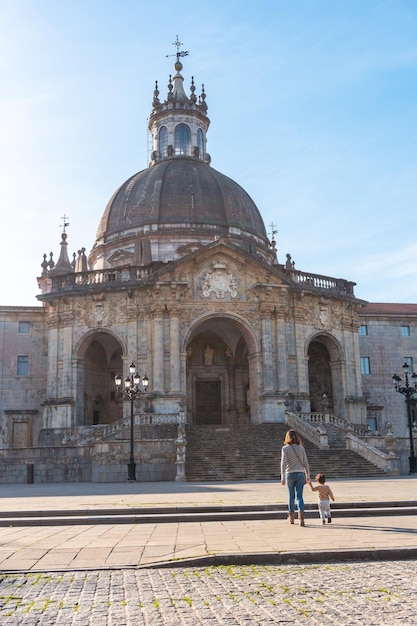 Mother and son tourists visiting the Sanctuary of Loyola Baroque church of Azpeitia