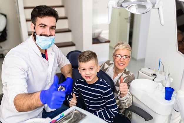 Mother and son visiting dentist office.