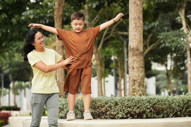 Mother and Son Walking in Park