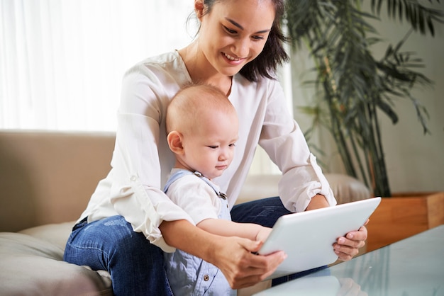 Mother and son watching cartoon