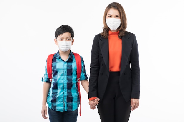 Mother and son wearing surgical mask.