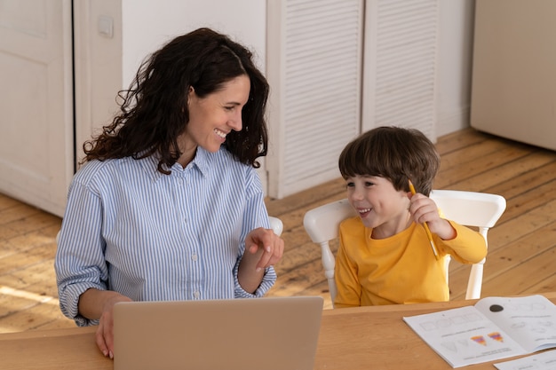 Mother and son work and study together from home