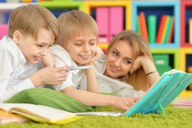 Mother and sons doing homework