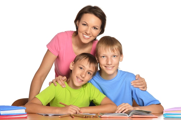 Mother and sons doing homework