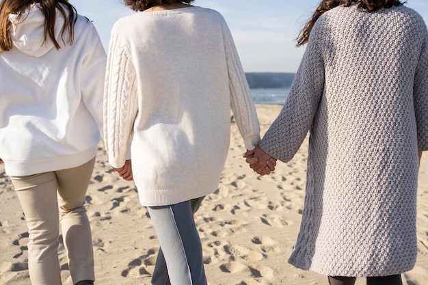 mother spending time with her daughters at the beach