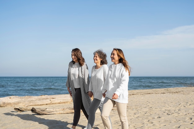 mother spending time with her daughters at the beach