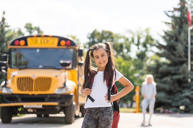 Mother taking her daughter to school, saying her goodbye for the day