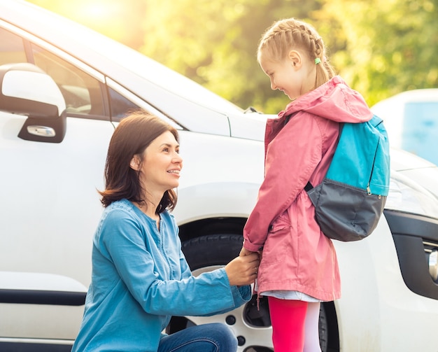 Mother taking little girl to school