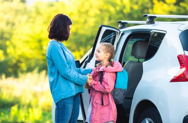 Mother taking primary schoolgirl back to school