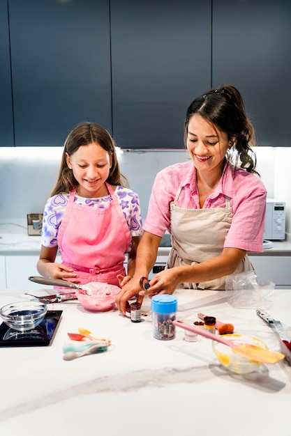 Mother teaching her daughter the art of baking