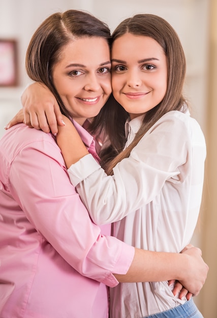 Mother and teen daughter at home together.