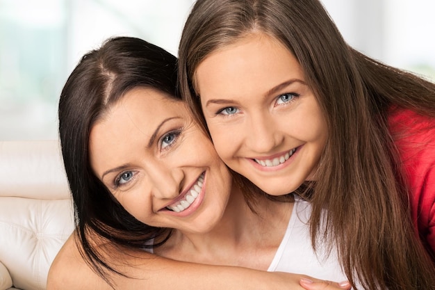 Mother teenager daughter braces family smiling cheerful