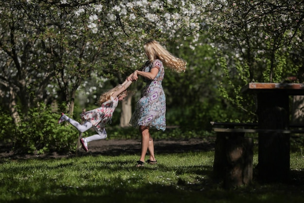 Mother twist daughter in the garden