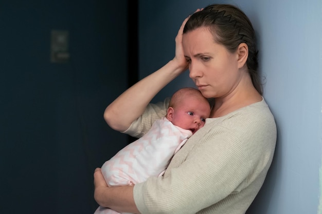 Photo mother with baby suffering from post natal depression